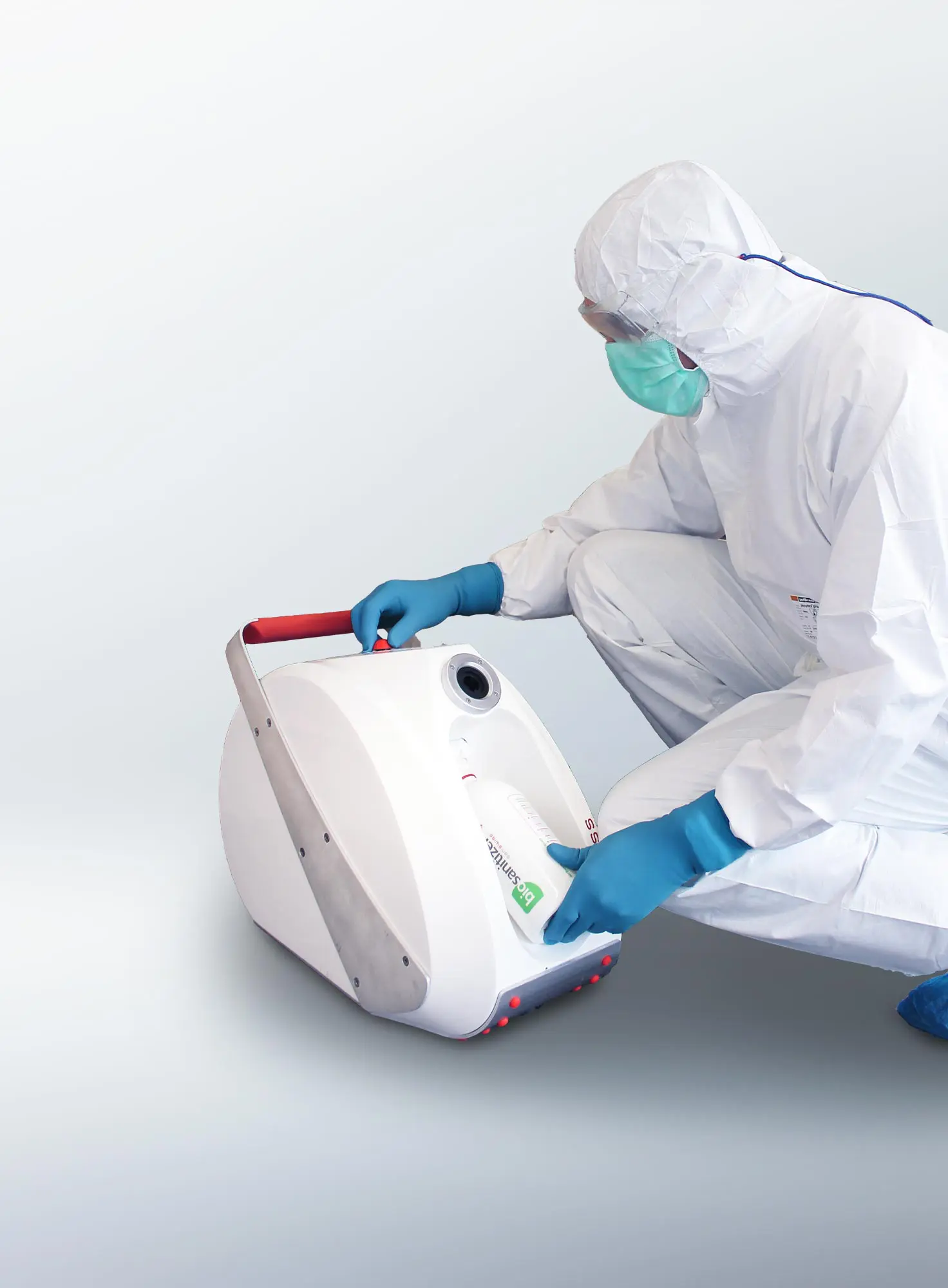 A laboratory technician decontaminates the room with the biosanitizer machine aHP.
